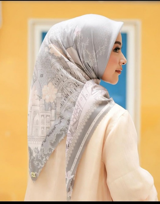 A green cup of a coffee on a wooden table